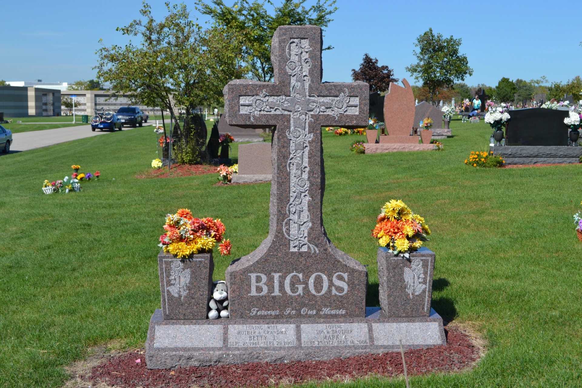 Gravestone cross in cemetery with the name 