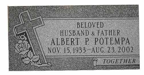 Headstone of Albert P. Potempa, with cross and rose. Dates: 1933-2002. 