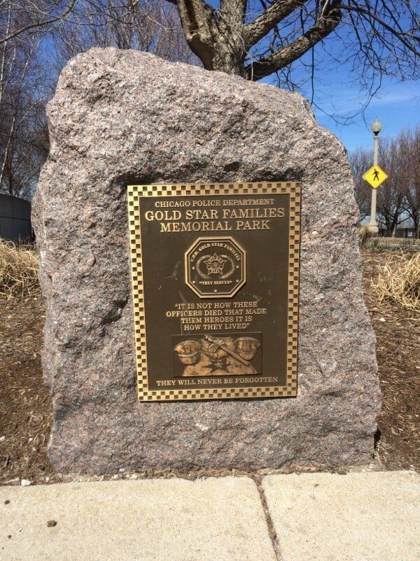 Memorial plaque for Chicago police families, on a granite stone.