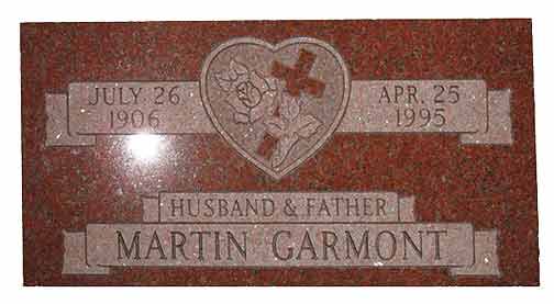 Red granite headstone: dates, a cross in a heart, and 