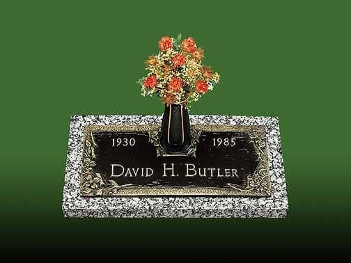 Grave marker for David H. Butler, with dates 1930-1985. Features a vase of flowers.