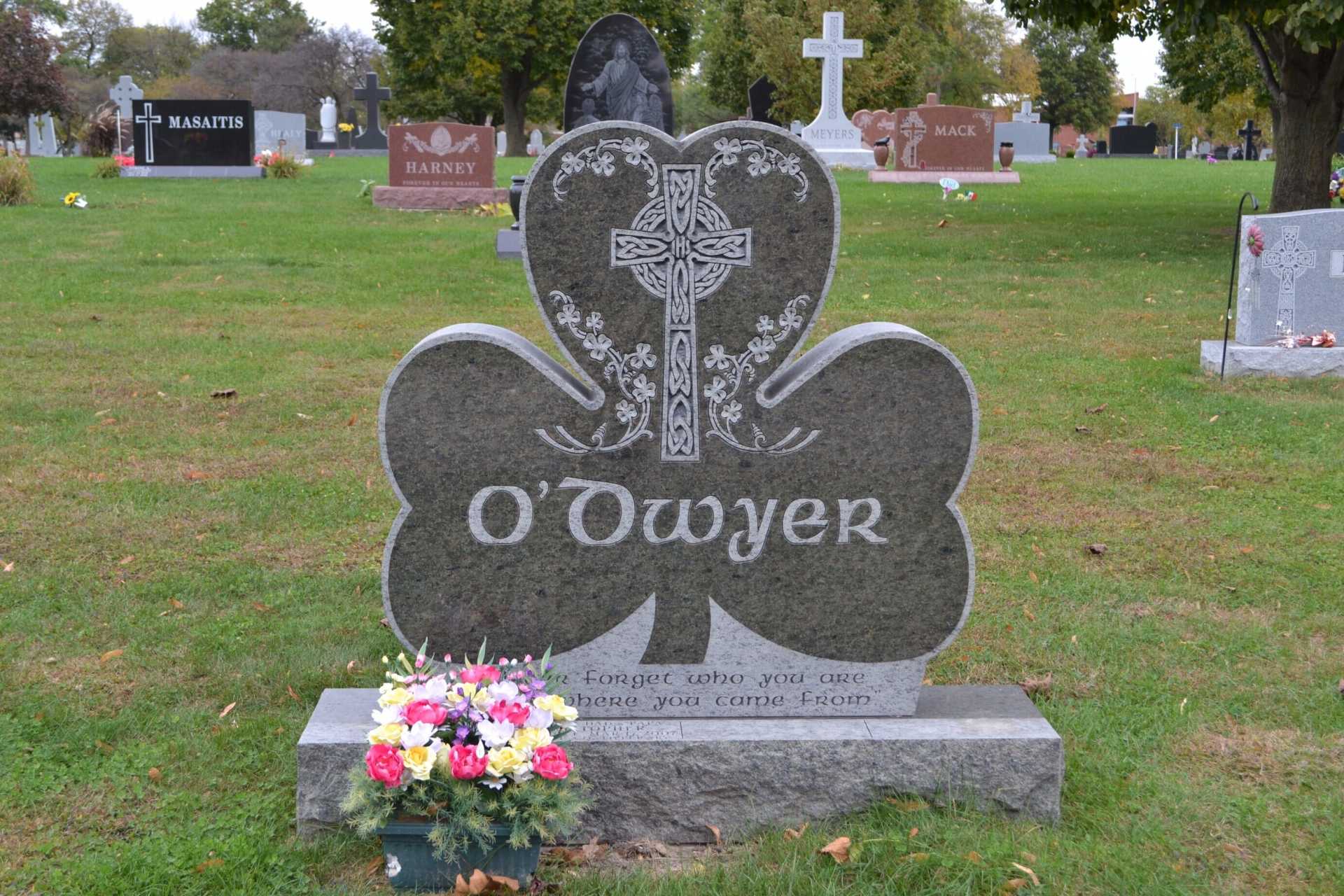 Shamrock-shaped tombstone in a cemetery, 