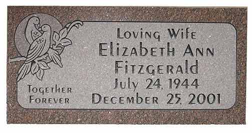 Headstone of Elizabeth Ann Fitzgerald, with carved birds and the dates July 24, 1944 - December 25, 2001.
