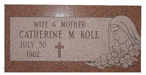 Gravestone of Catherine M. Kole, with birth date, cross, woman silhouette, and floral design.