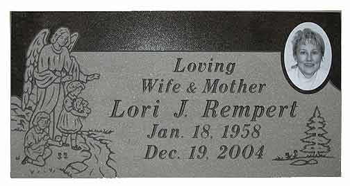 Headstone: Lori J. Rempert, with angel and children engraving, photo, birthdate 1958, death date 2004.