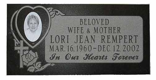 Black granite headstone with a photo of Lori Jean Rempert, her birth/death dates, and 