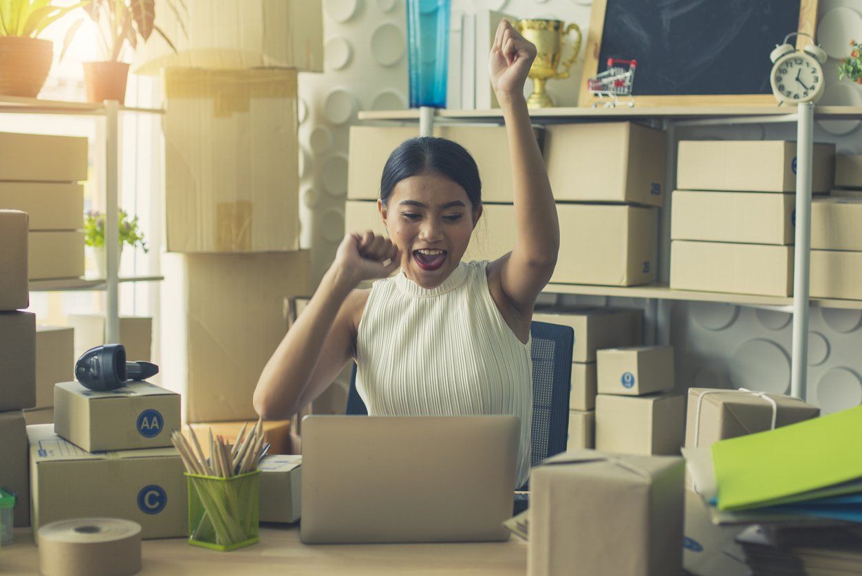 Businesswoman celebrating he business accomplishments - a concept showing a person's new year's resolutions for his business.