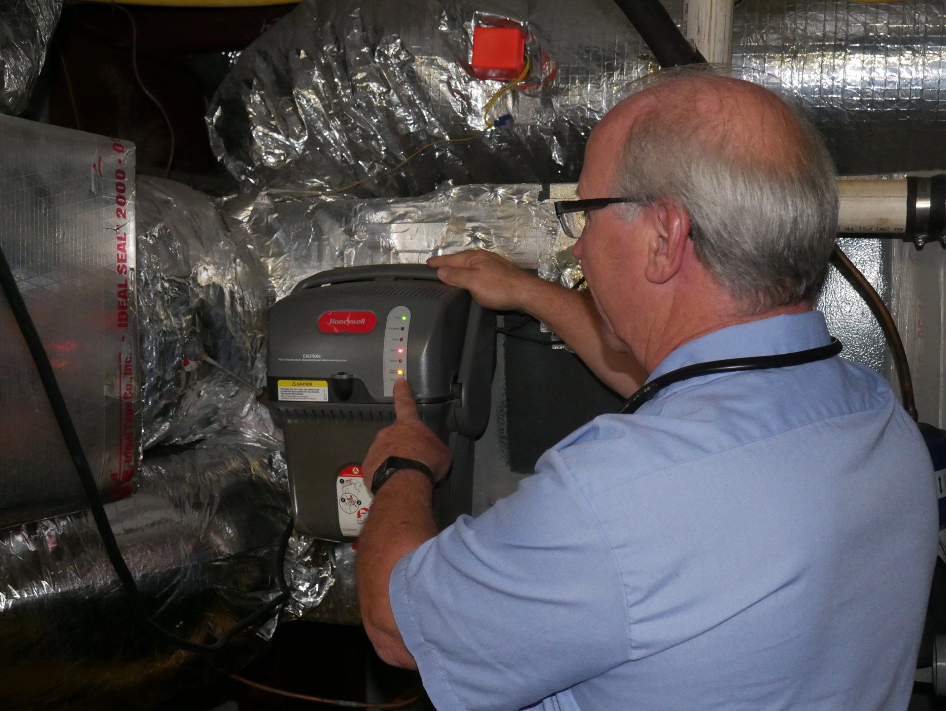 Furnace Repair — Adjusting Gas Water Heater in Jonesboro, GA