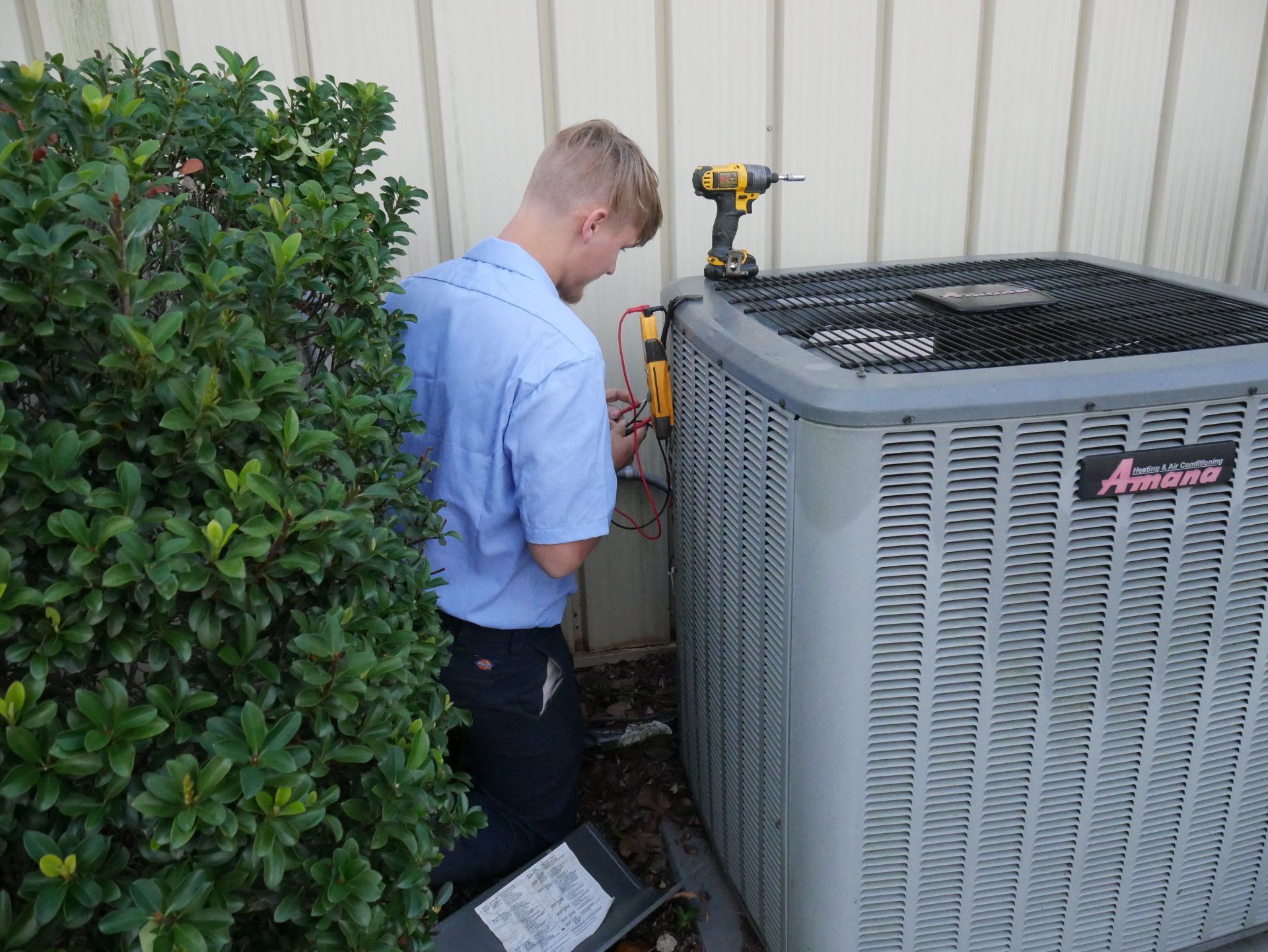 Air Conditioning — Technician Checking Air Conditioner in Jonesboro, GA