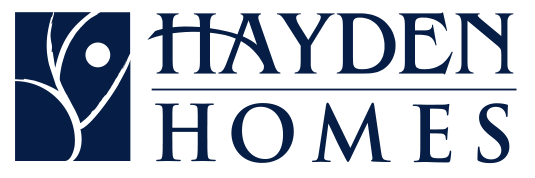 The hayden homes logo is blue and white with a flower in the middle.
