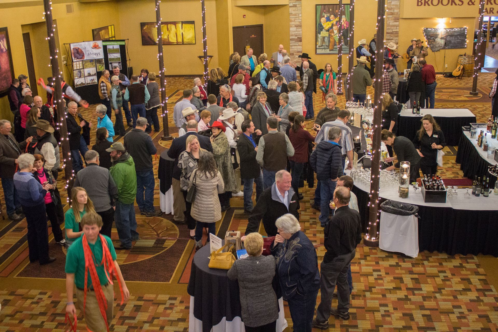 A large group of people are gathered in a large room.
