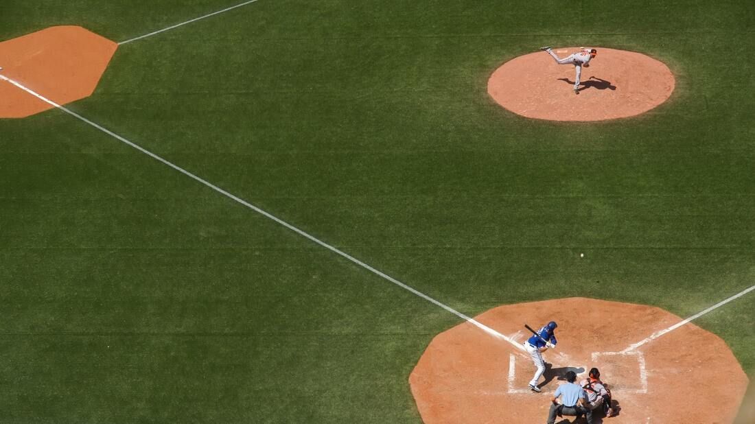 An aerial view of a baseball game being played on a field.