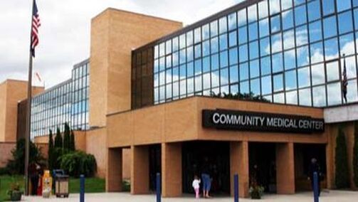 A large building with a sign that says community medical center