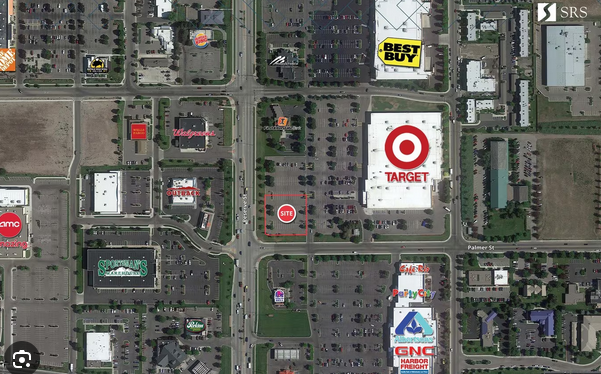 An aerial view of a shopping center with a target store in the middle.