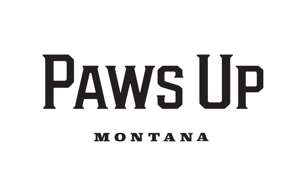 A black and white logo for paws up montana on a white background.
