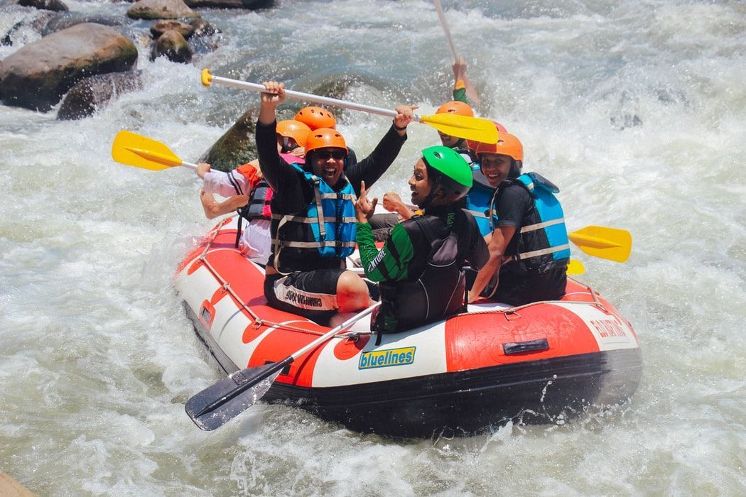 A group of people are rafting down a river.
