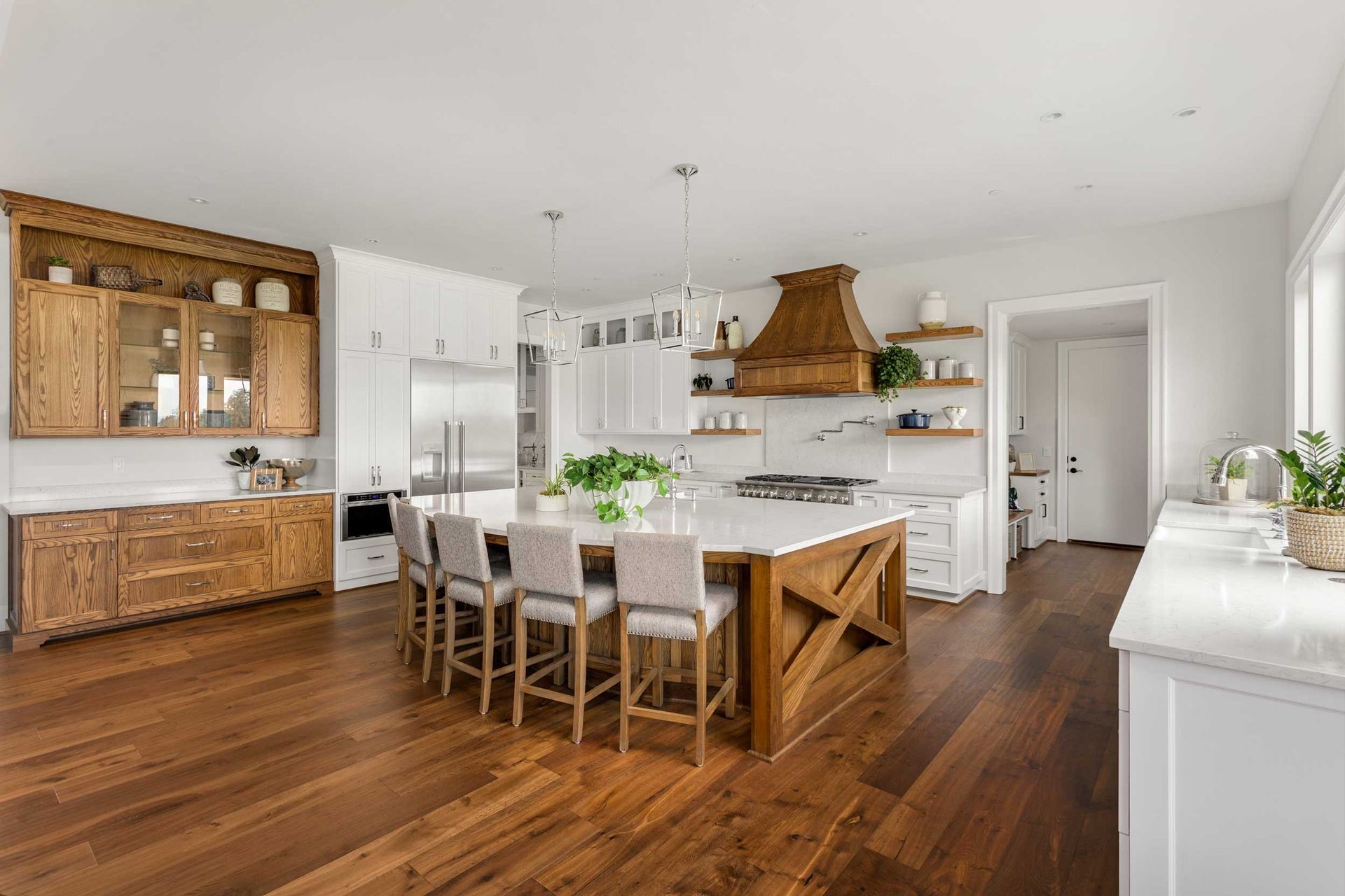 Kitchen with a beautiful floor from residential wood floor installation.