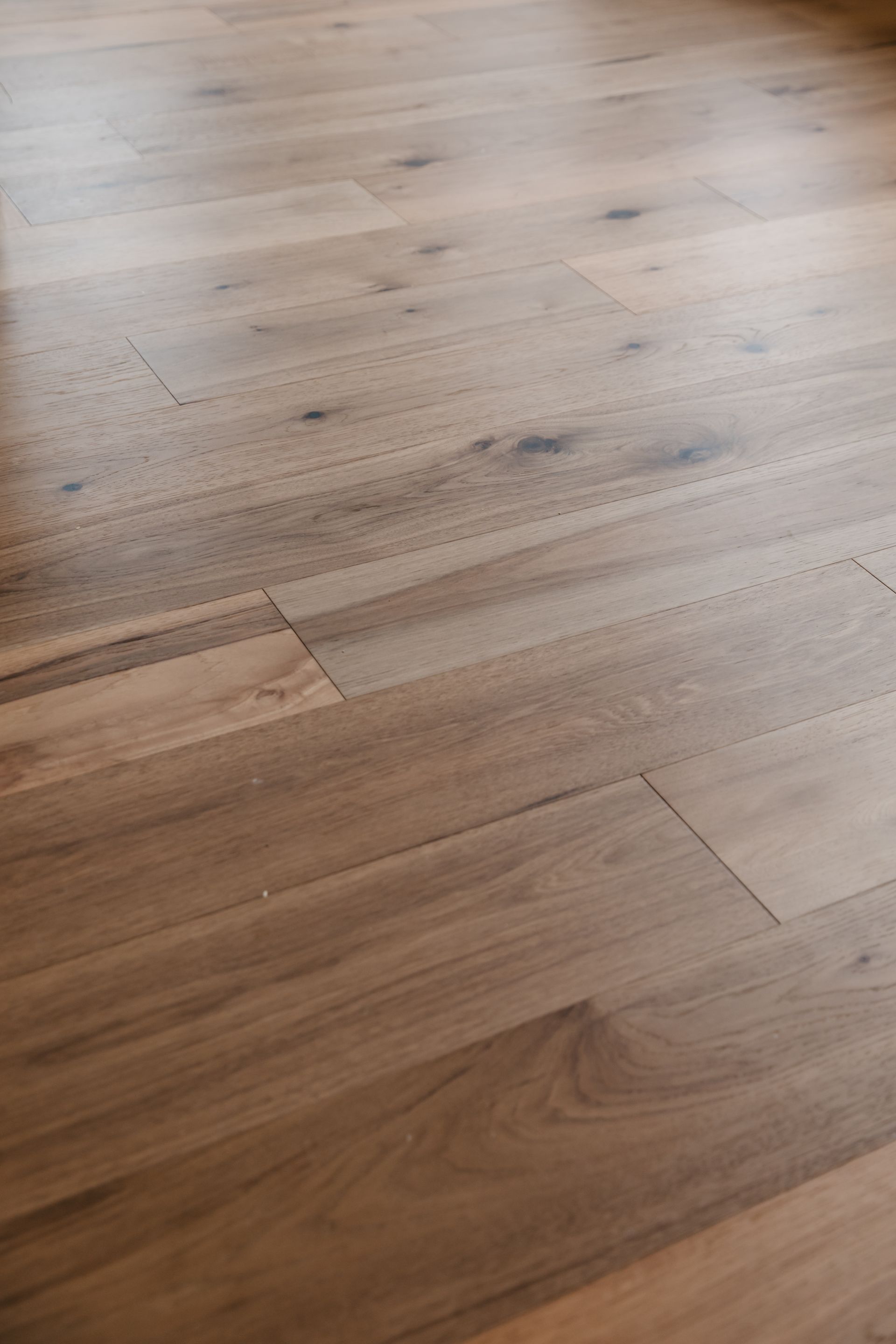 A close up of a wooden floor in a room.