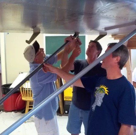 A man wearing a blue shirt with a statue of liberty on it
