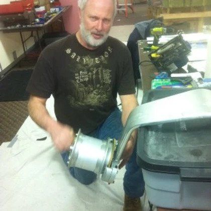 A man with a beard wearing a shirt with the word eagle on it