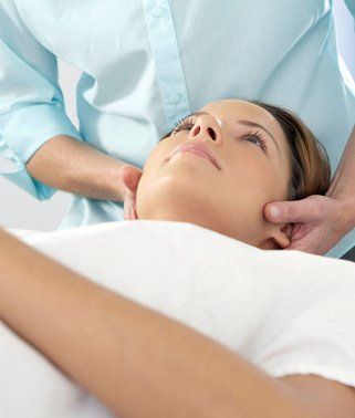 woman getting a chiropractic treatment 