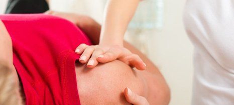 Man getting sports massage therapy