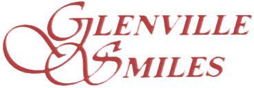 the logo for glenville smiles is red and white on a white background .
