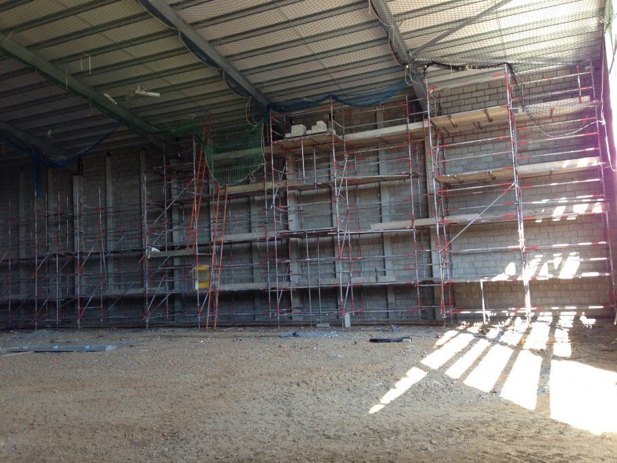 A large building with scaffolding on the side of it.