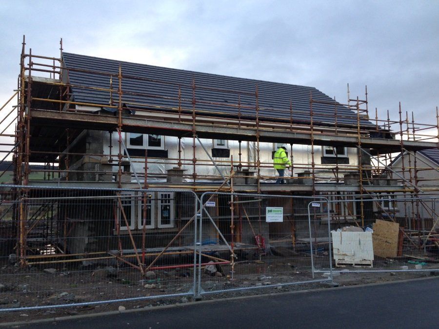 A building under construction with scaffolding around it