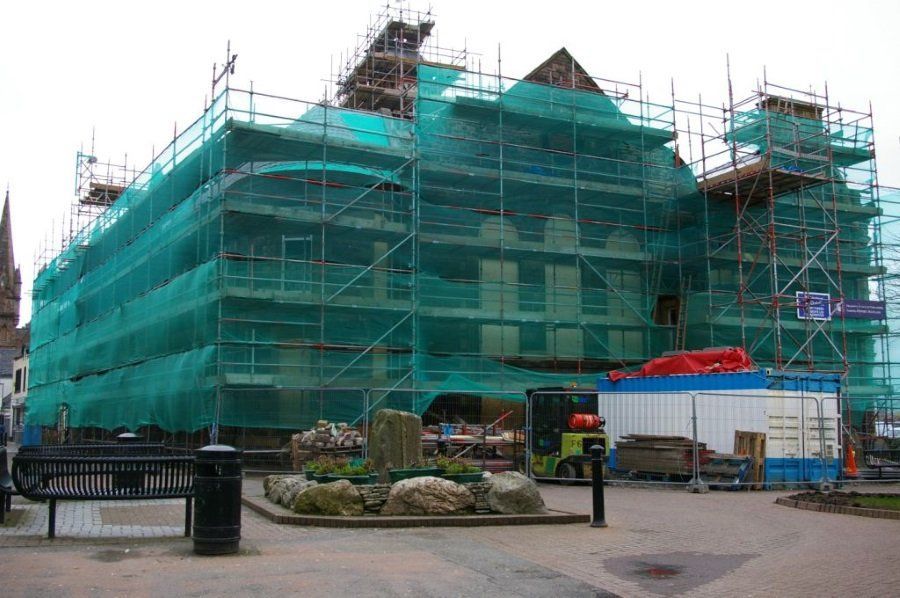 A large building is being built with scaffolding around it.