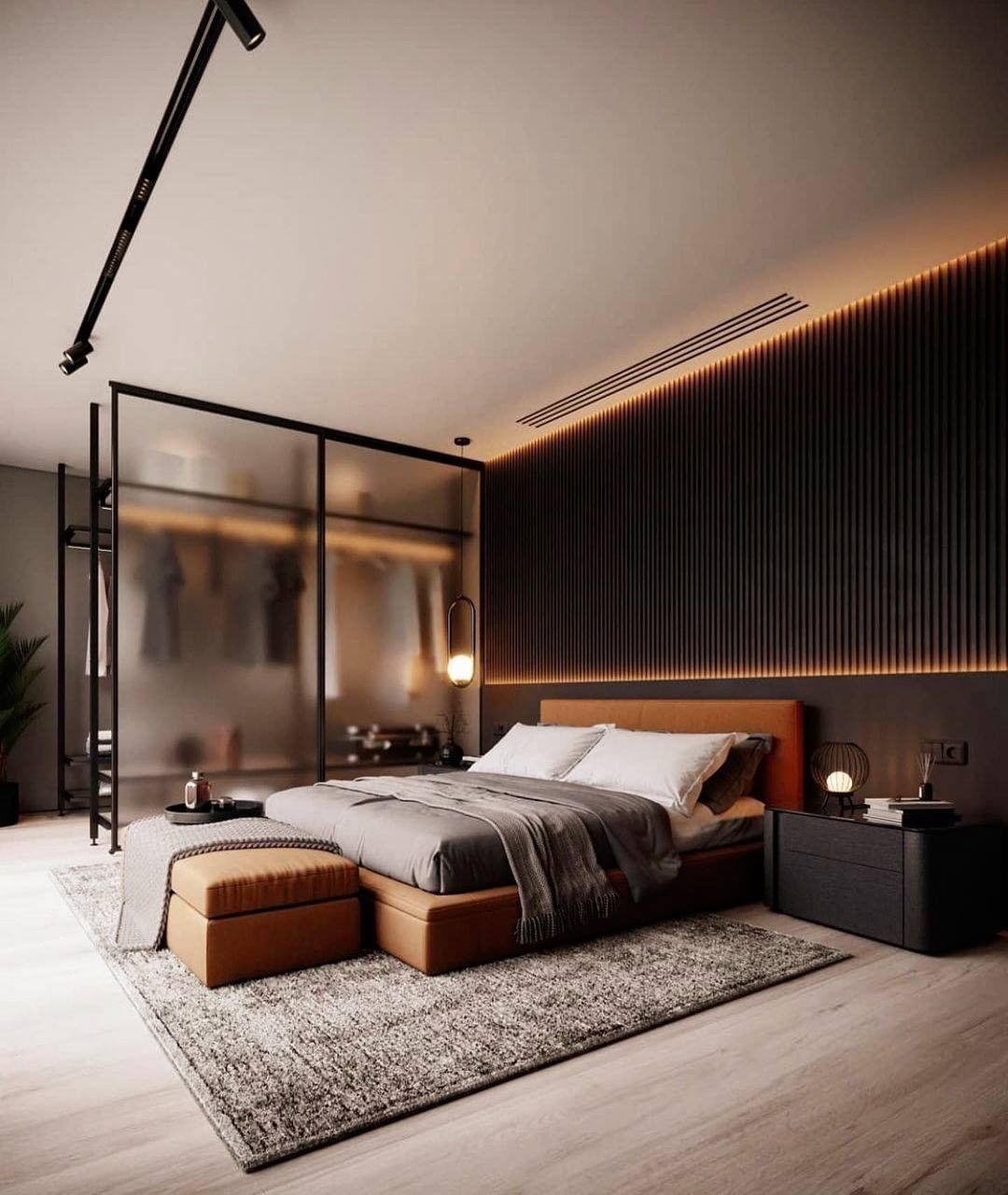 Camera da letto moderna con letto, pouf e armadio con parete in vetro. Parete scura con illuminazione ambientale.