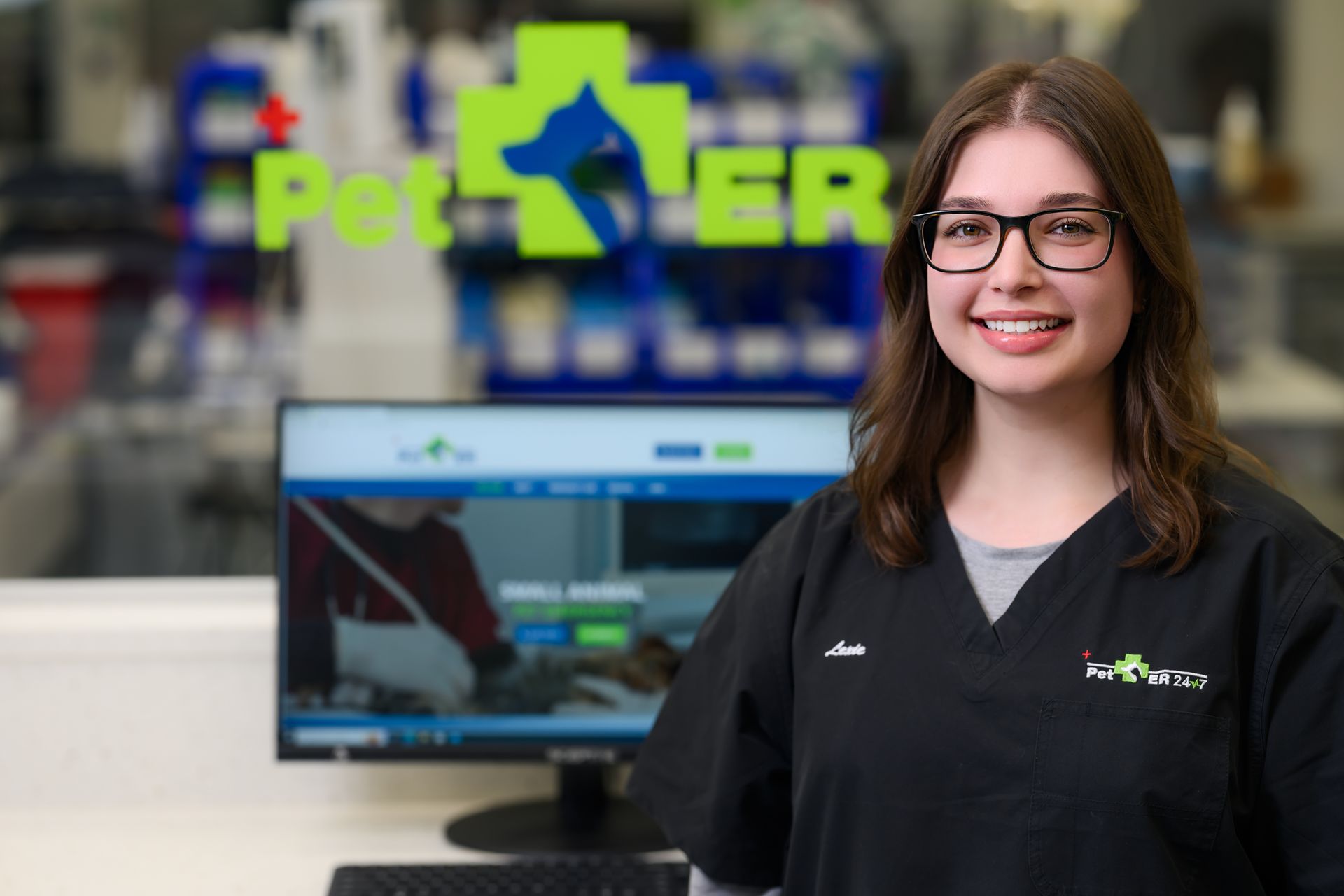 Medical cart with monitor and equipment in a clinical setting.