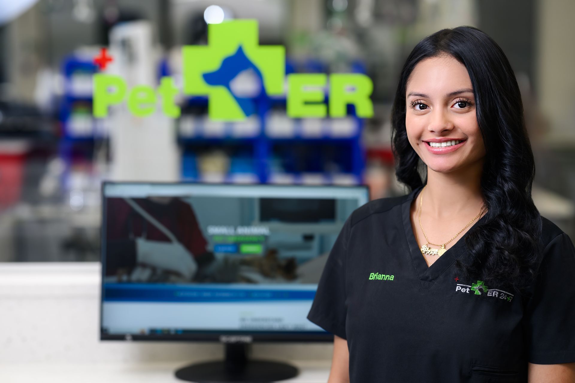 Veterinary examination room: stainless steel, medical equipment, and adjustable exam table.