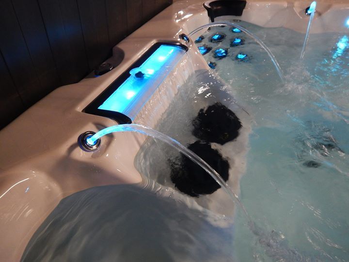 A hot tub with water coming out of it