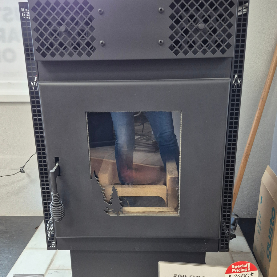 Optimum 509-1 presto log stove display model with black steel body, front viewing window, and compact freestanding design in Olympia WA