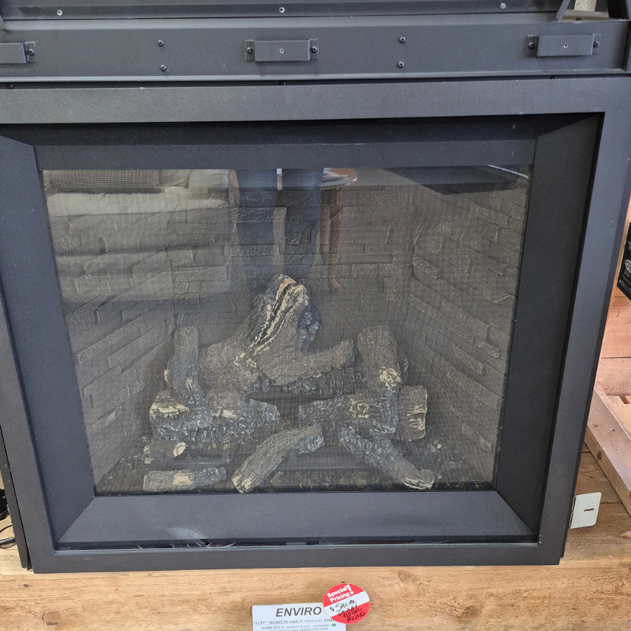 Enviro G39 gas fireplace insert display model with black surround, arched viewing area, and realistic log set in Olympia WA