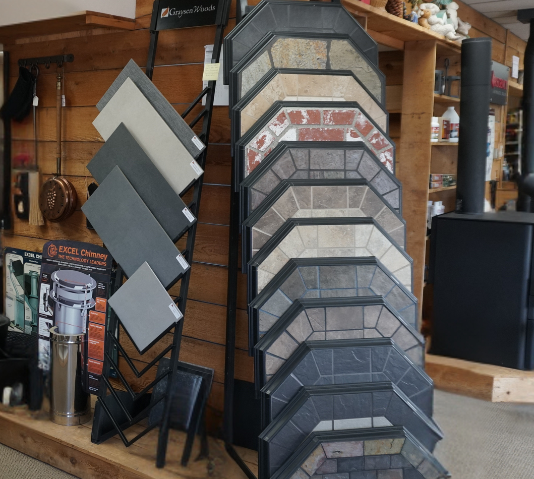 Display of Hearth Classics stove bases used to support and finish freestanding stove installations