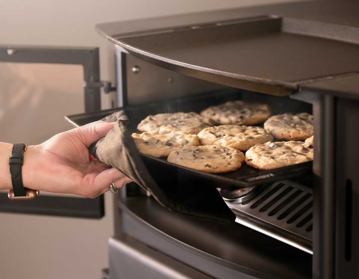 Kuma Applewood Cookstove with wood fired oven and cooktop for home heating and cooking.