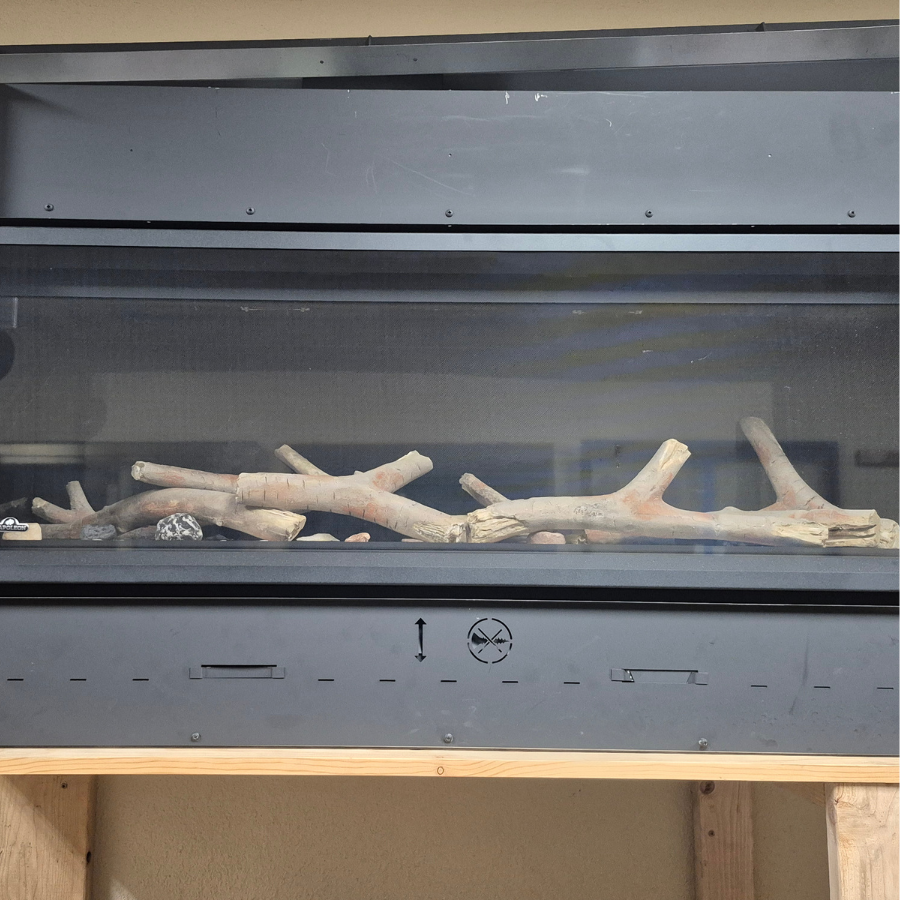 Napoleon Luminex 74 linear gas fireplace display model with wide horizontal viewing area, modern black frame, and glass media in Olympia WA