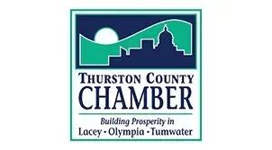 Logo for Thurston County Chamber: Blue and teal design with a silhouette of a city skyline, a rising sun, and text.
