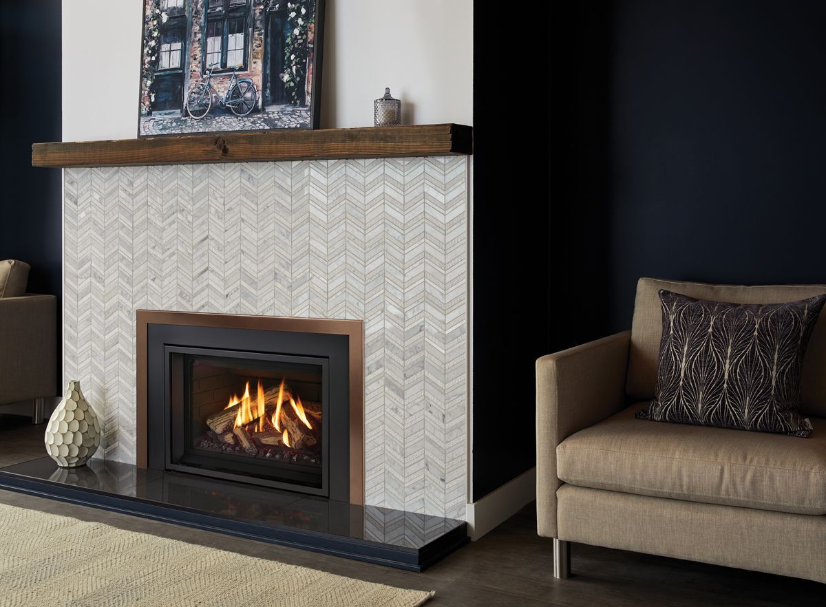Updated fireplace with modern gas insert providing reliable warmth in Ocean Shores, WA