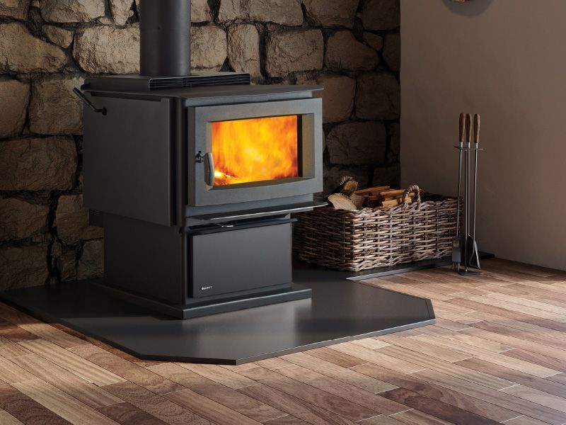 Freestanding wood stove with visible flames adding warmth and comfort in Lacey, WA installed by Capital City Stove