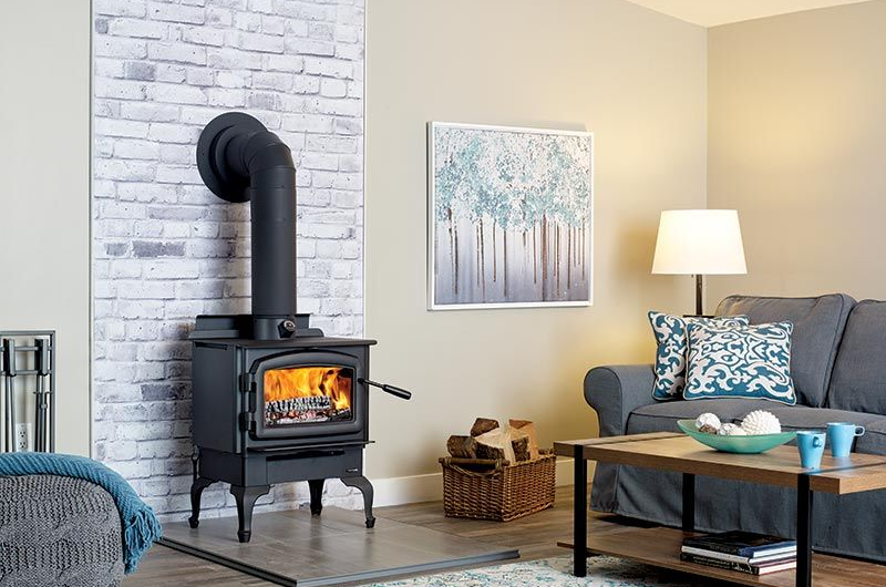 Freestanding wood stove providing efficient indoor heat in an Olympia, WA home