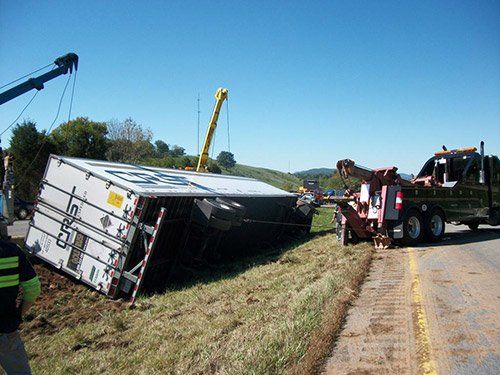 Tow Truck Pulling The Container — Max Meadows, VA — Complete Towing & Recovery Inc.