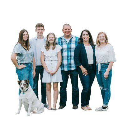 A group of people standing next to each other with a dog.