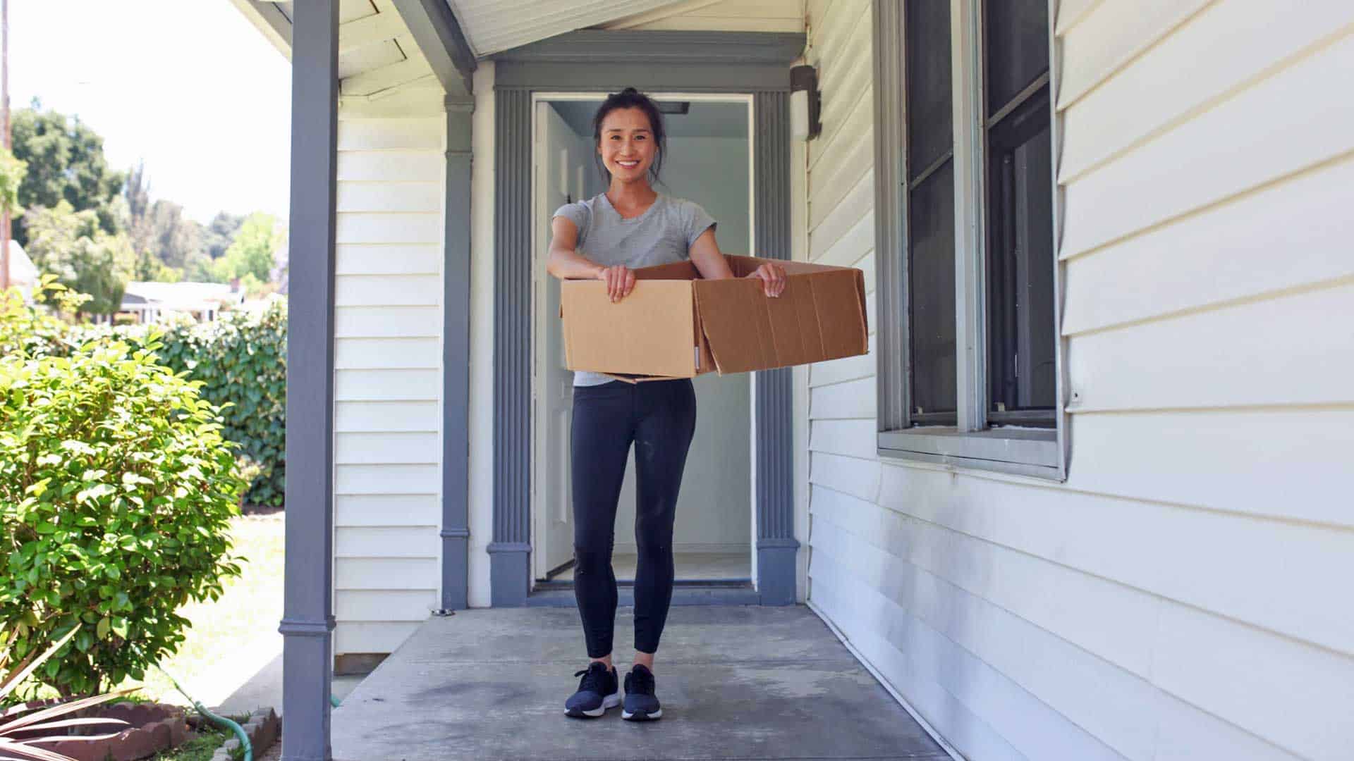 Photo of a woman with a moving box