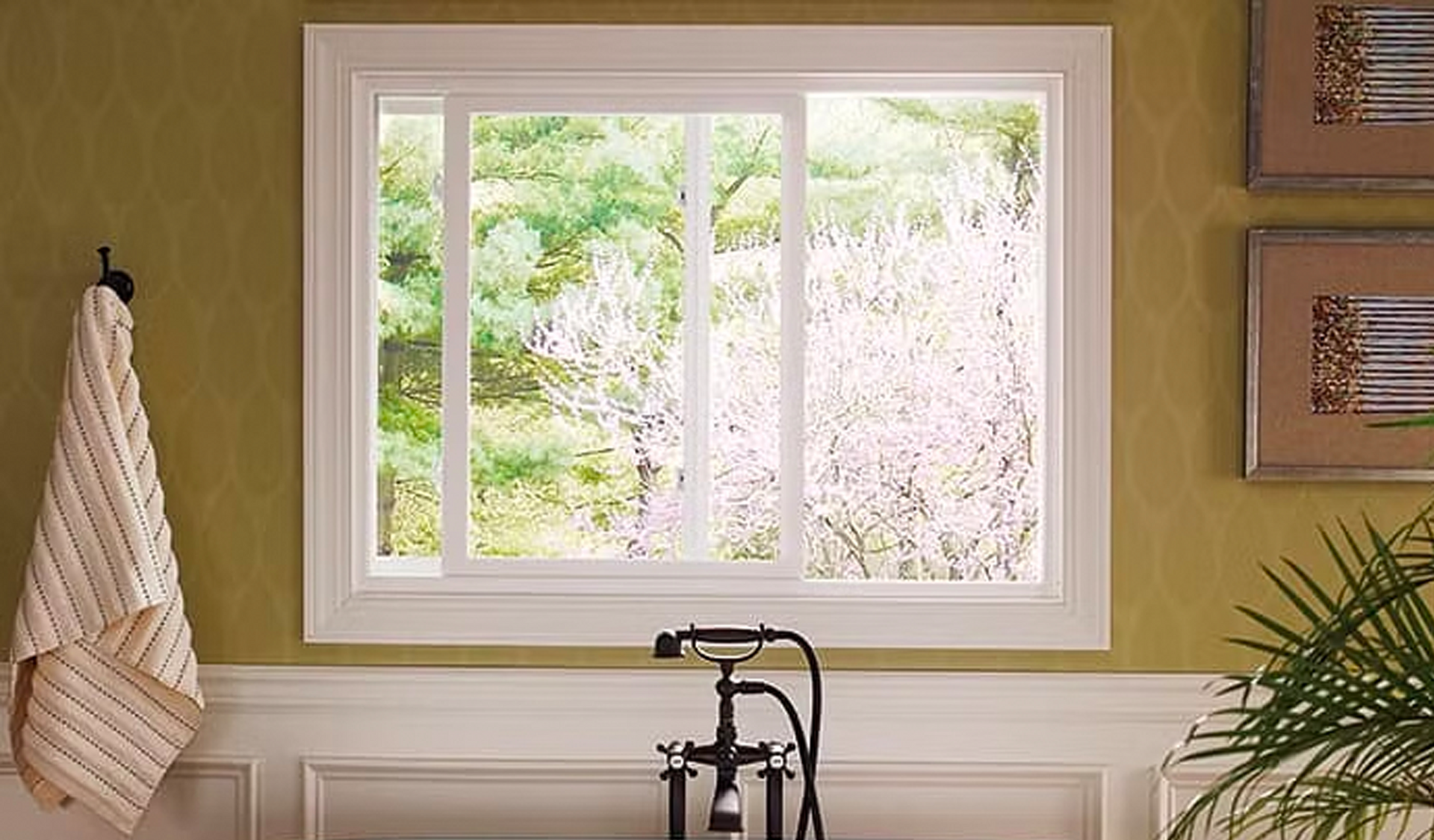 A bathroom with a large window and a bathtub.