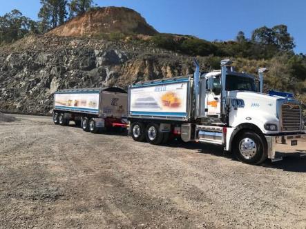 View of an extended blue and white  Hercules truck