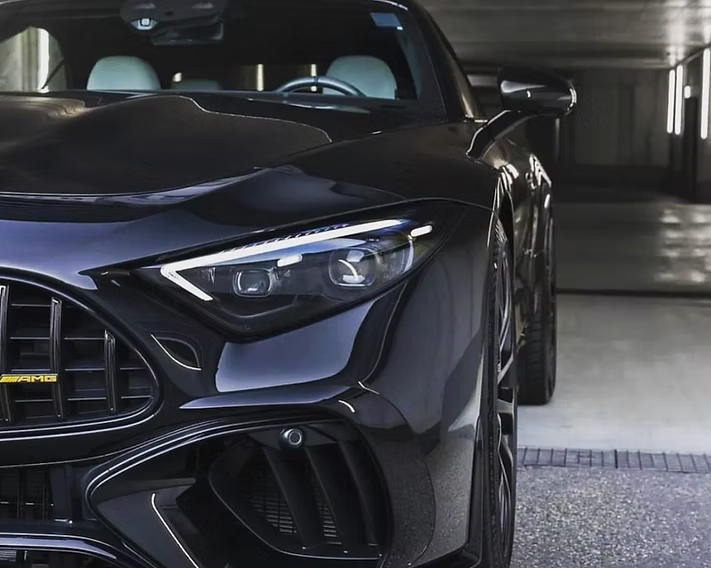 A black sports car is parked in a garage | AP Autohouse