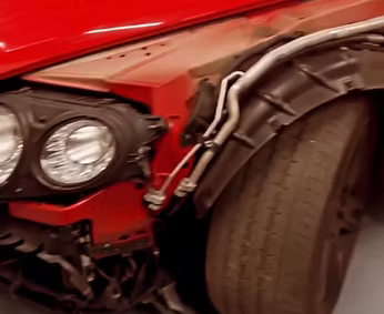 A close up of the front of a red tractor | AP Autohouse
